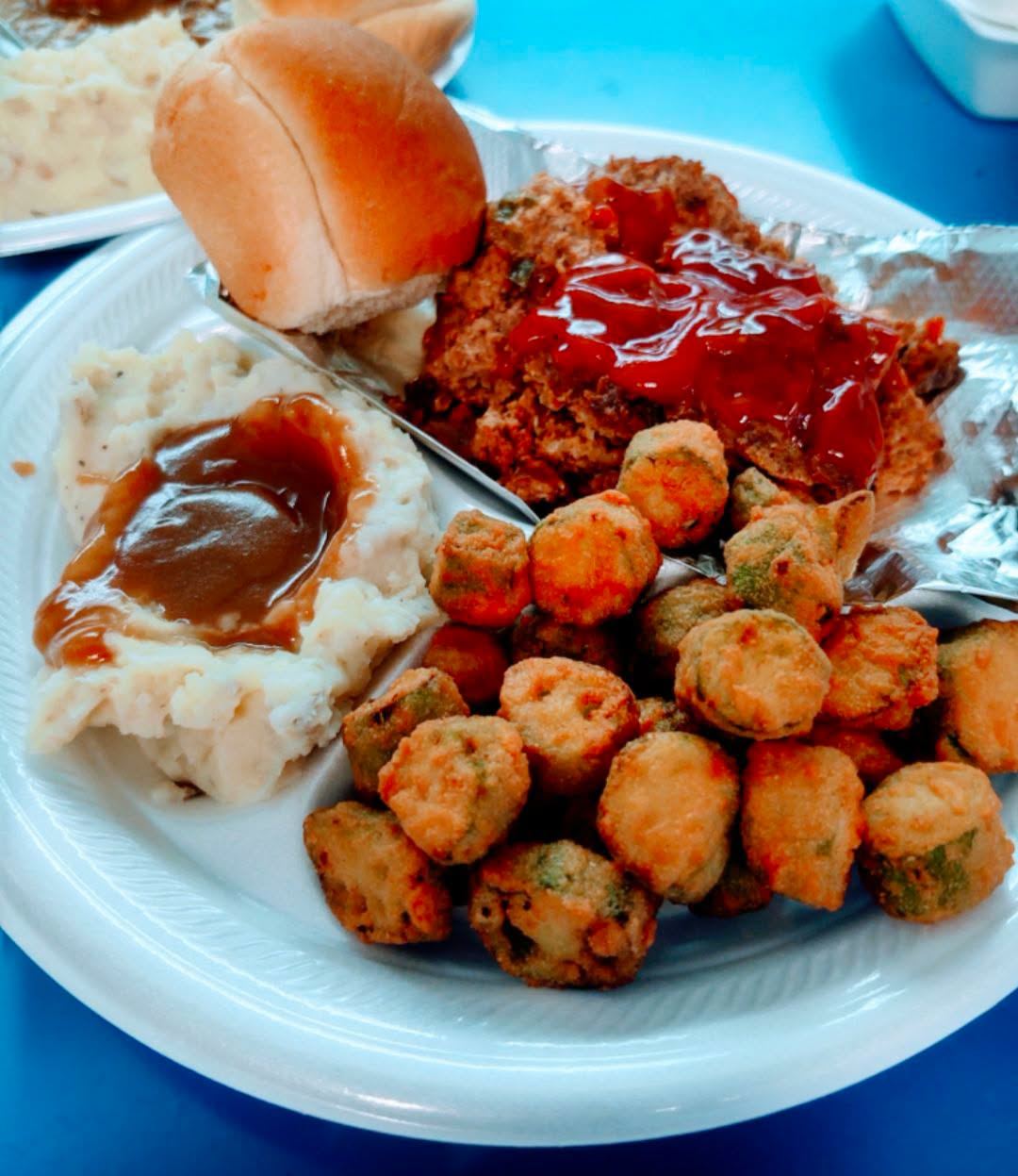 Smoked meatloaf with mashed potatoes and gravy, fried okra and a roll