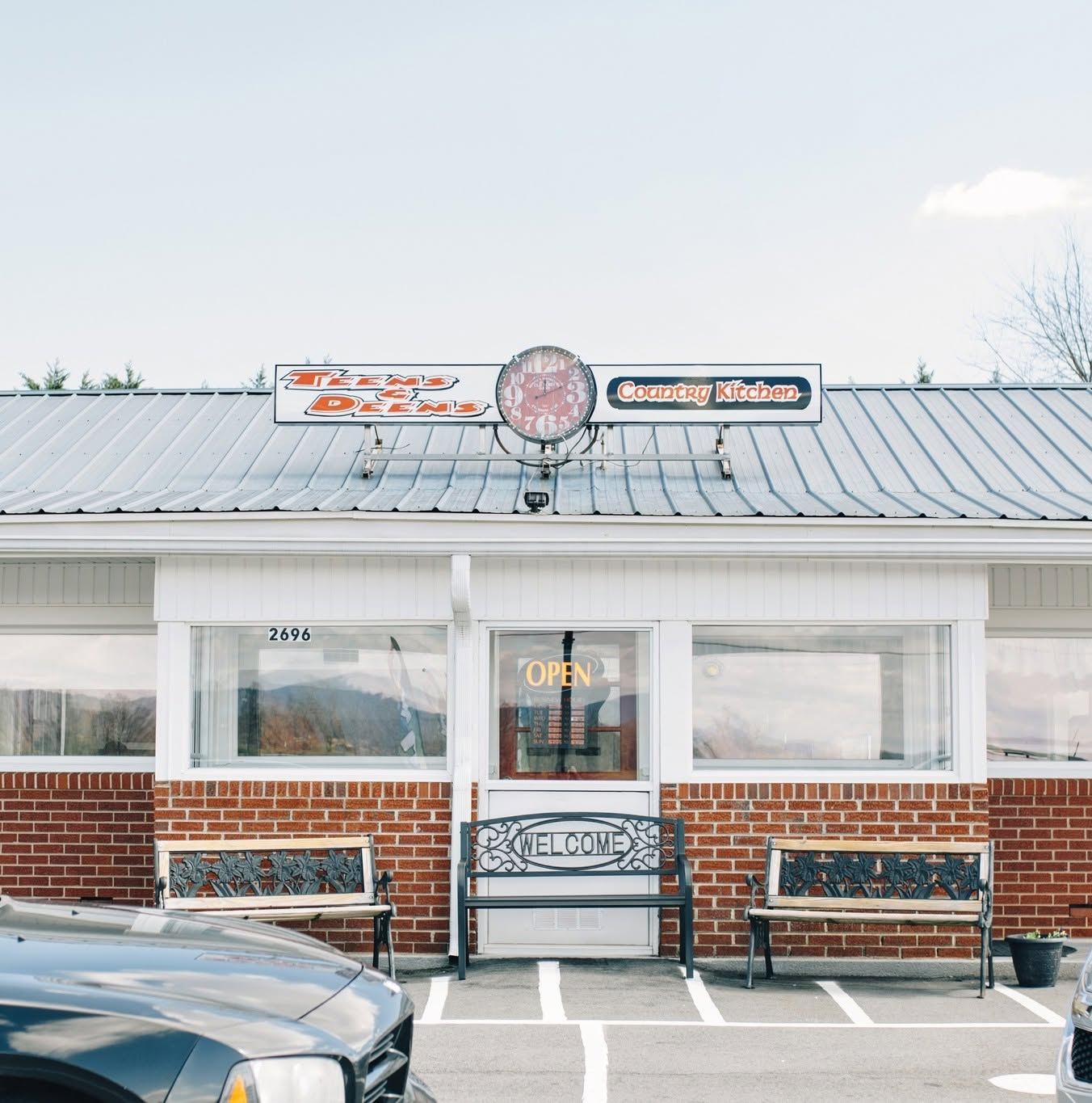 The Teens & Deens Country Kitchen storefront on NC 16 with benches out front